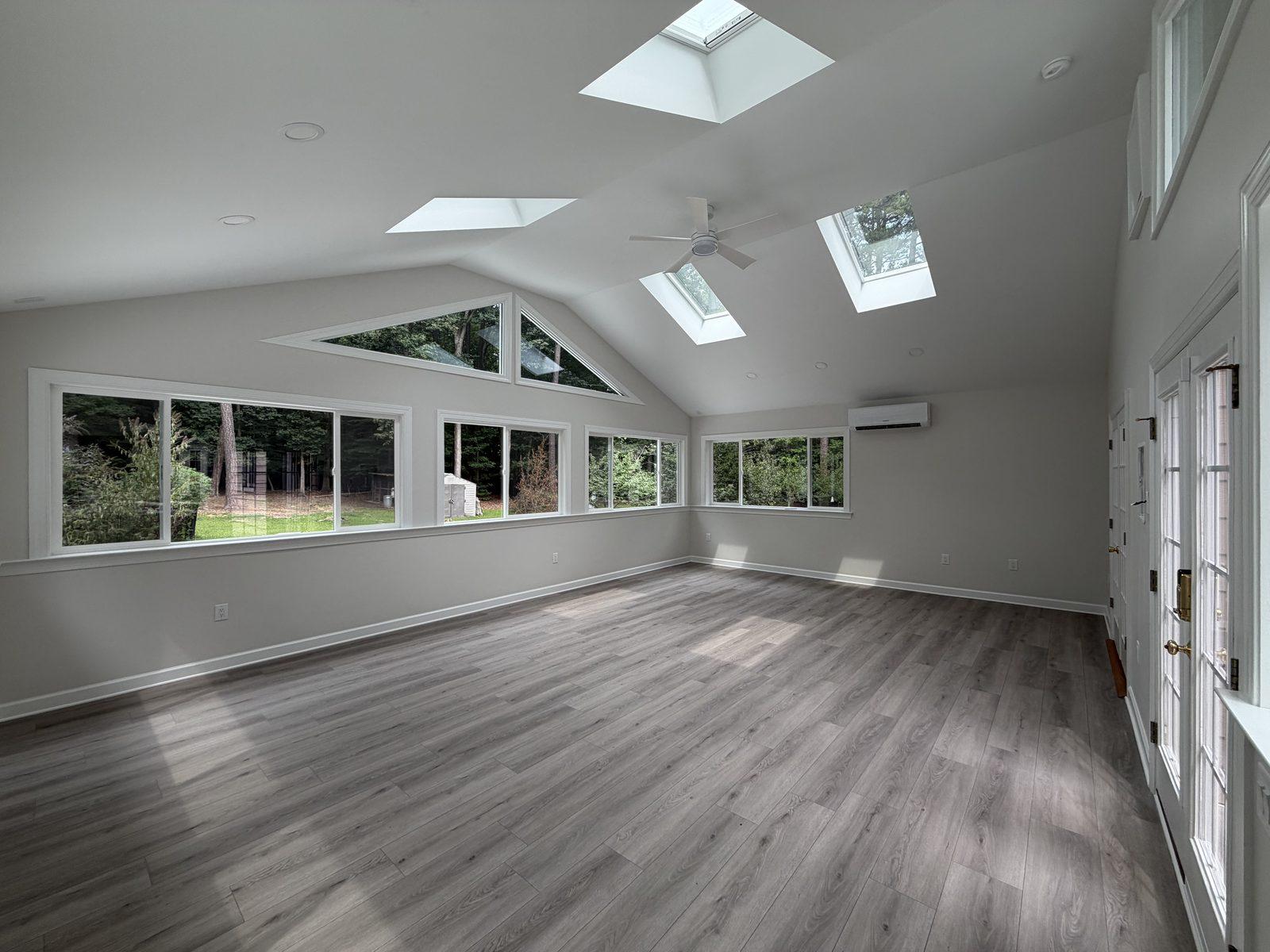 The sunroom looking toward the window bank and French doors onto the deck