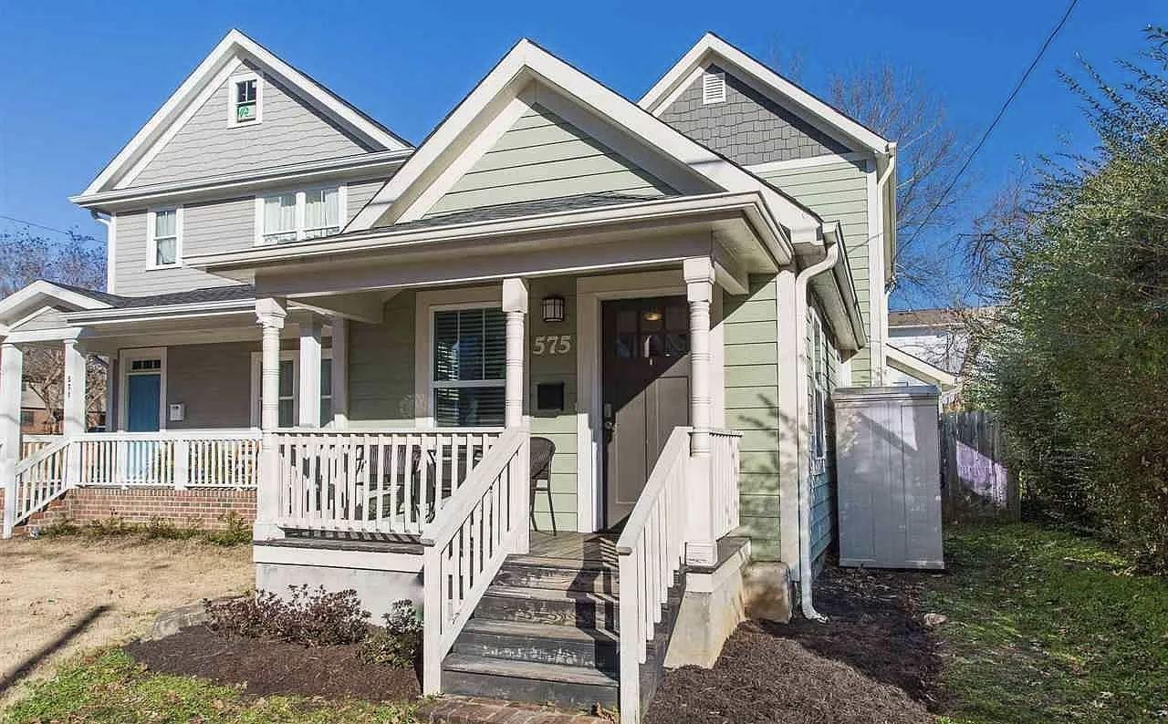 Renovated home exterior with a covered front porch and refreshed siding