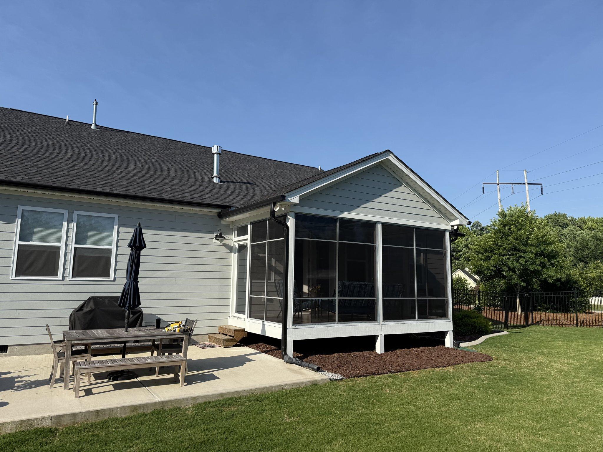 Completed screened three-season room on the rear of a home